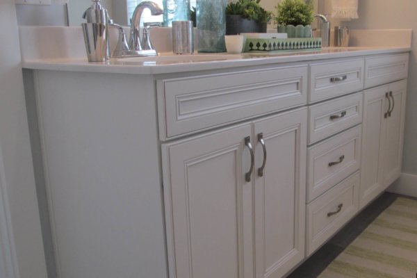 Stylish bathroom featuring sink, mirror, and towel rack.