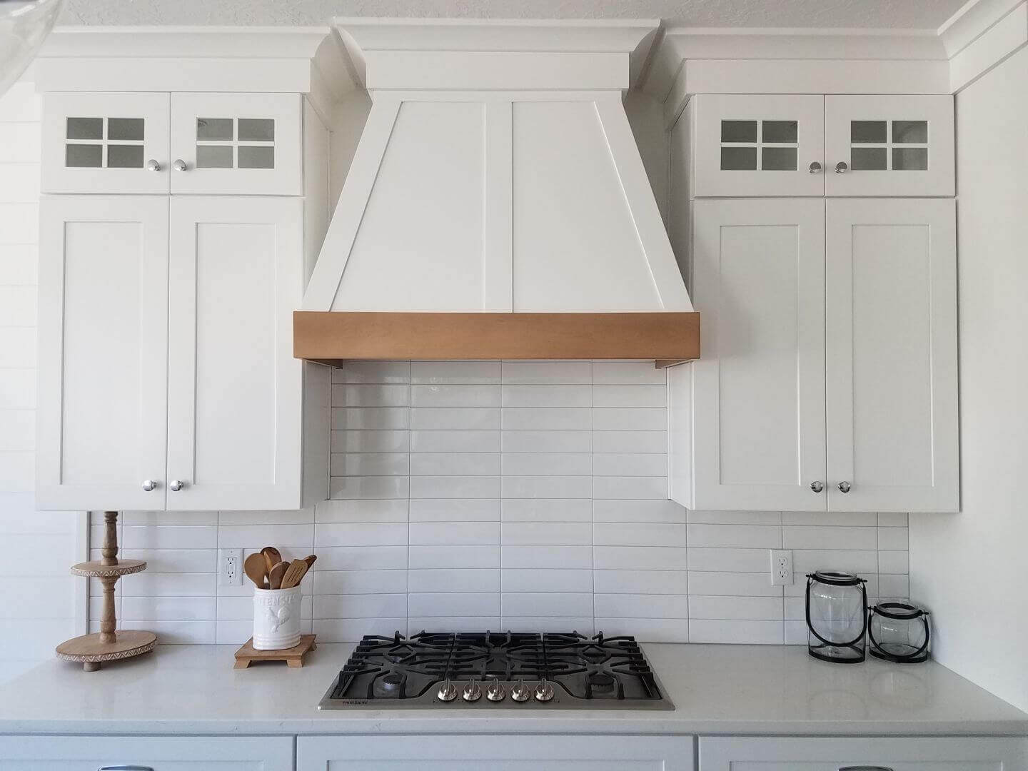 Modern white kitchen featuring stove and oven from Express Cabinets.