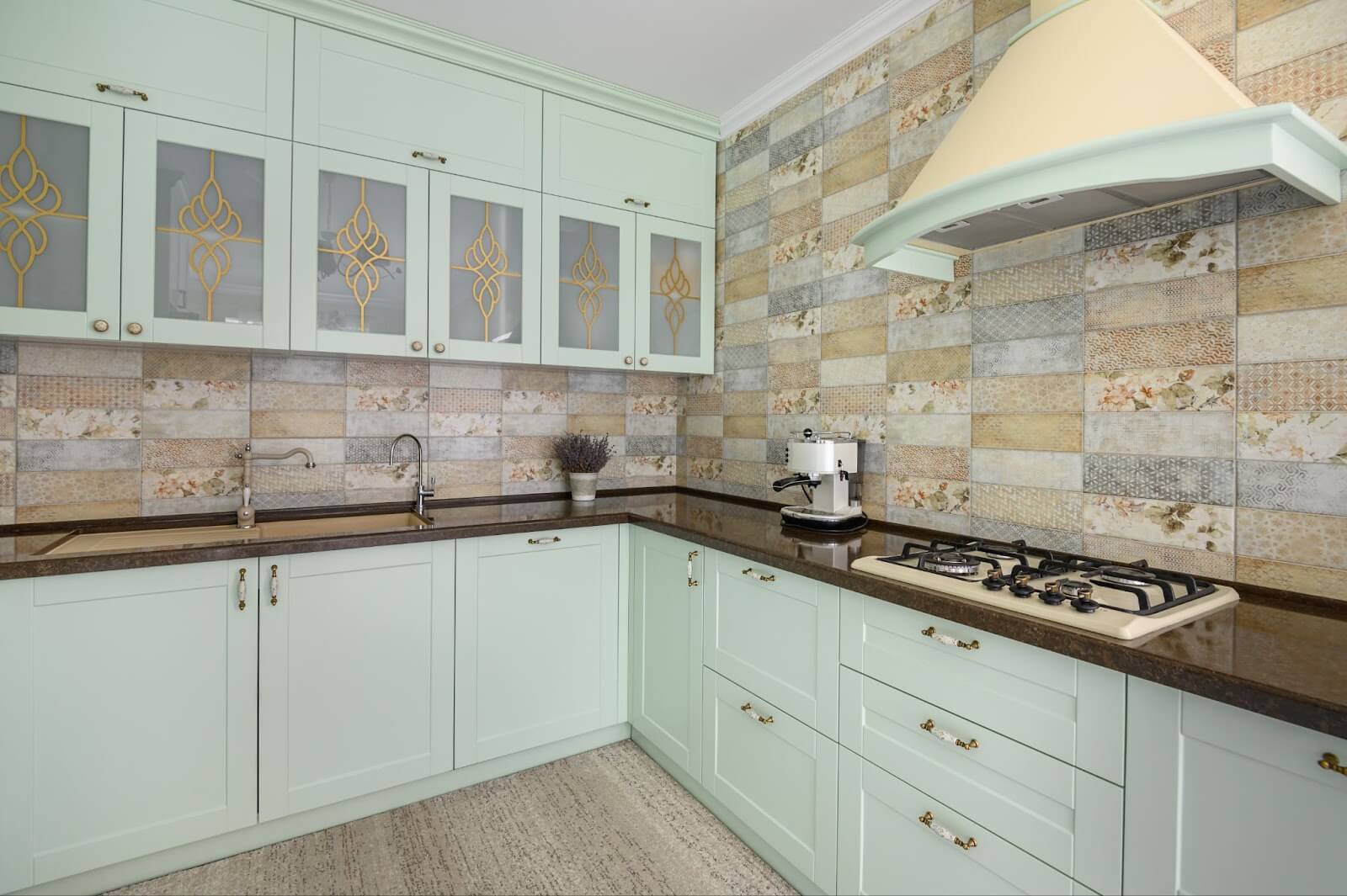 Green custom cabinets and stove in modern Utah kitchen